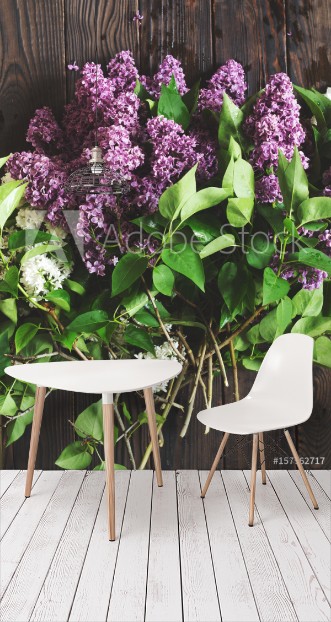 Picture of Flowering lilac branches on the dark wooden table